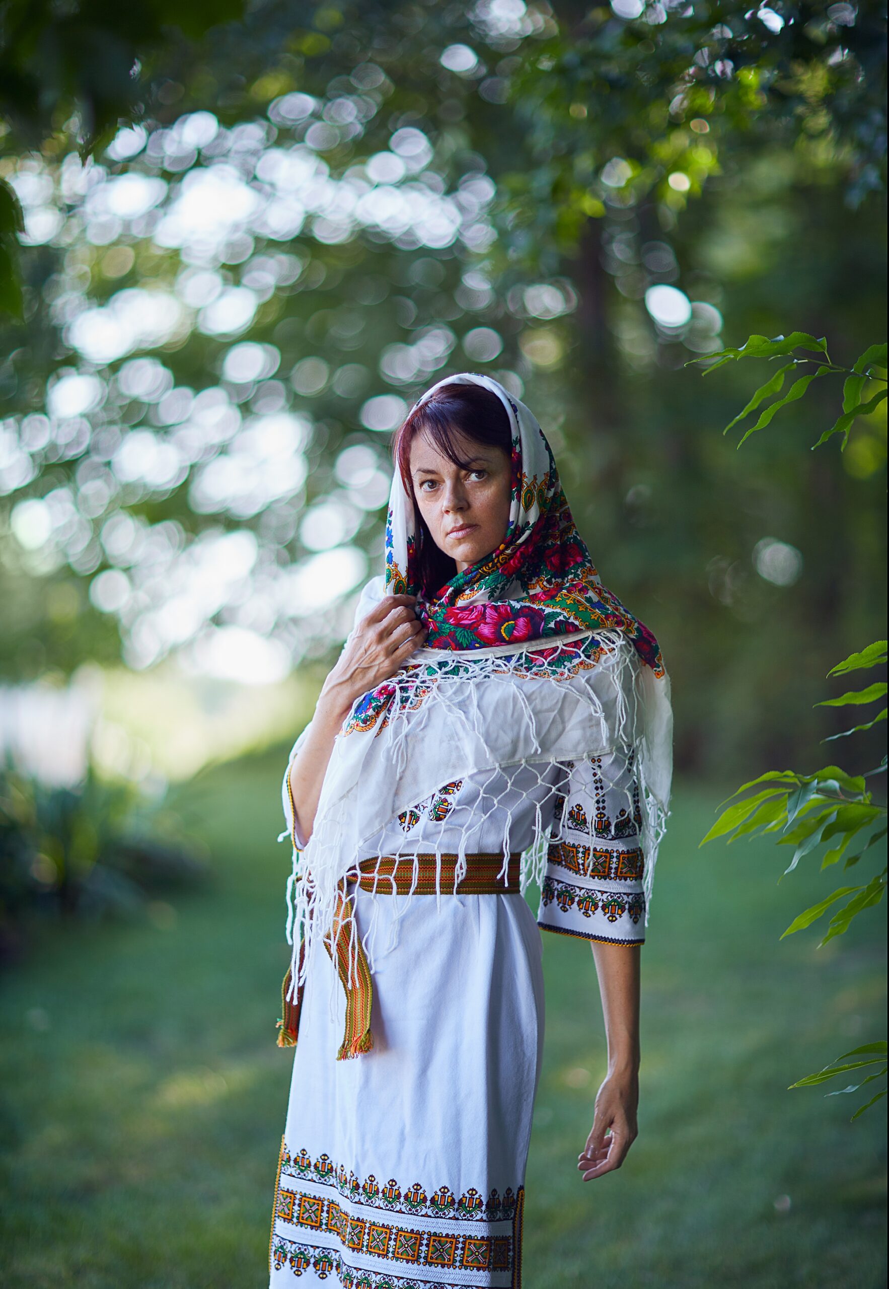 European woman standing in forest 