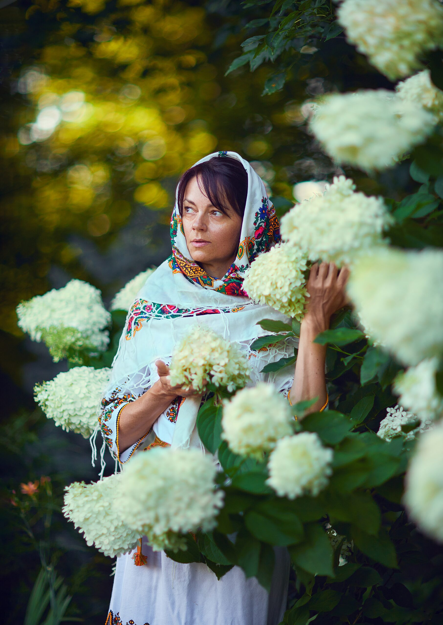 Slovak woman standing in flowers