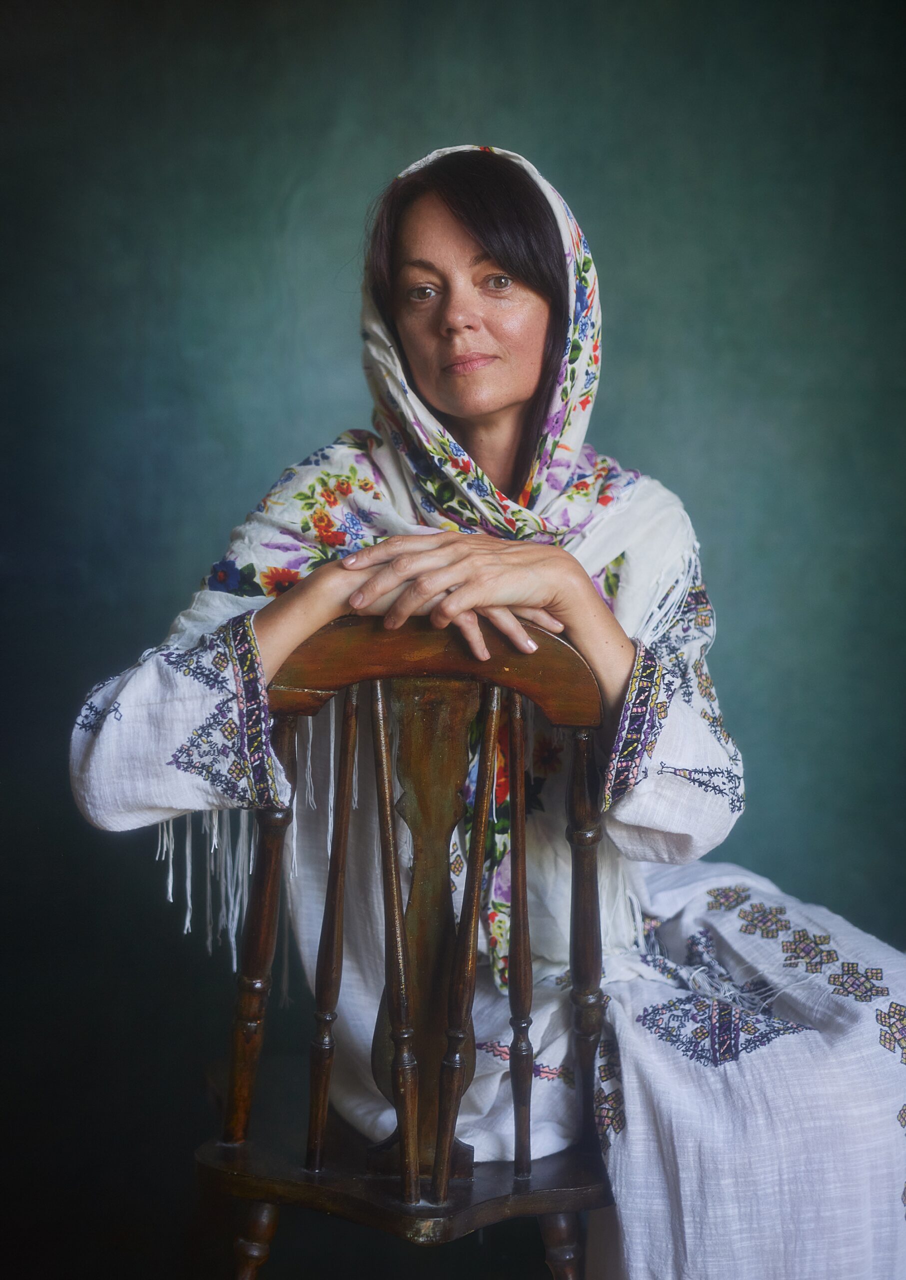 Ukrainian woman sitting in vintage chair 