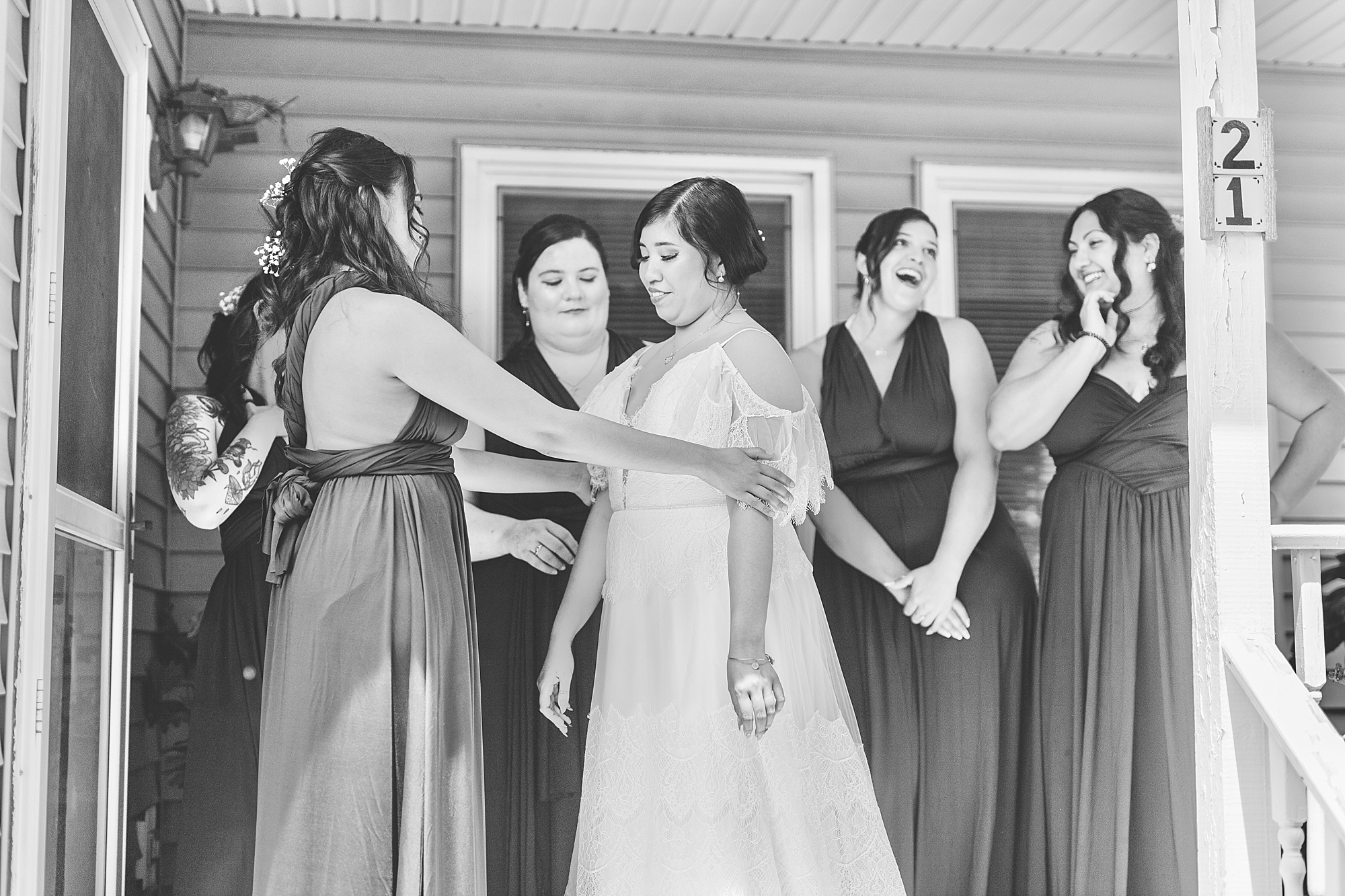 bridesmaids and bride on porch 