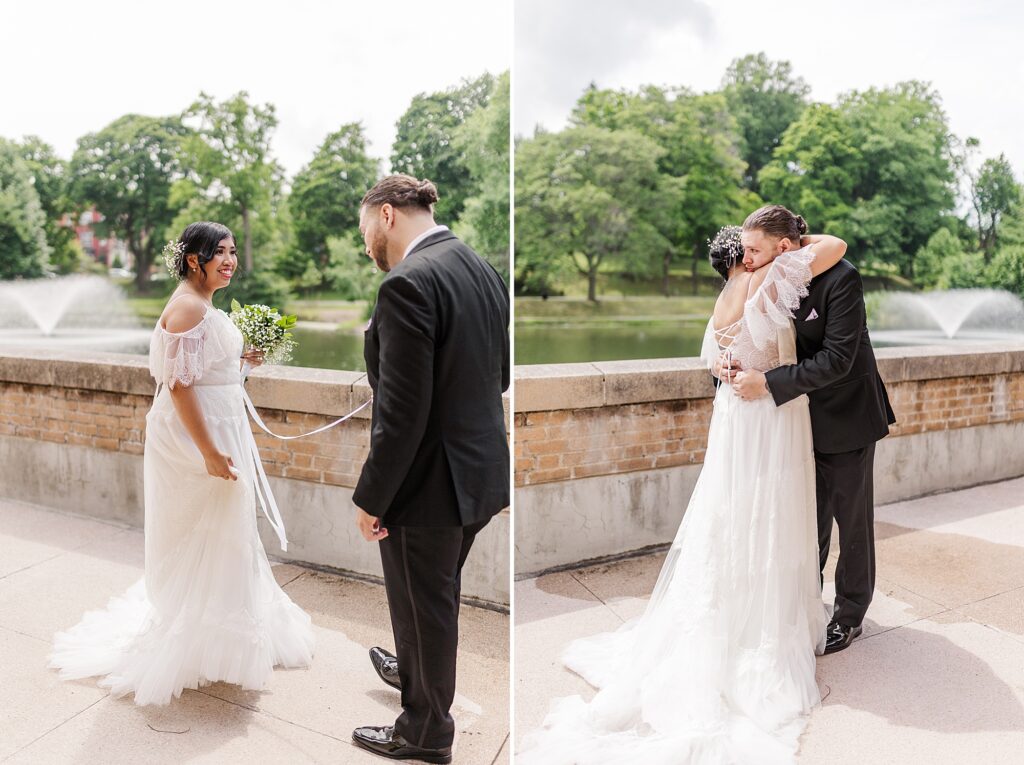 bride and groom embracing each other while over looking a lake 