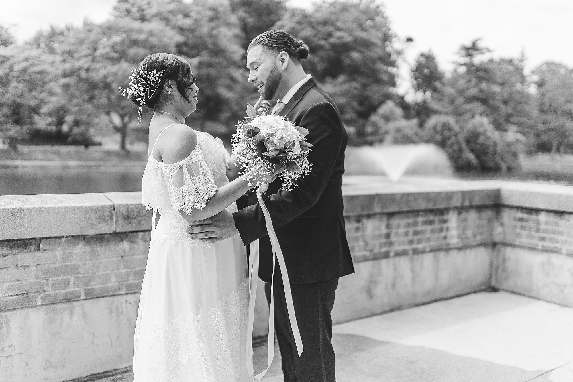 bride and groom looking at each other on outdoor patio 