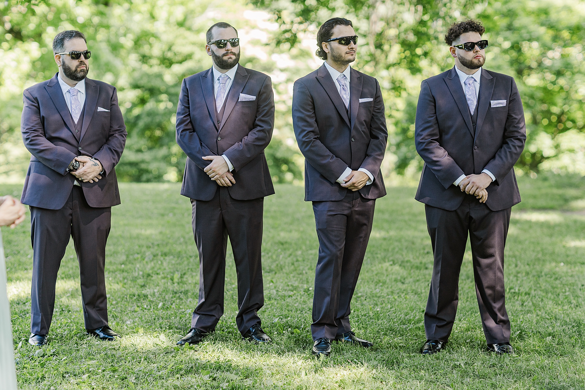 groomsmen watching wedding ceremony 