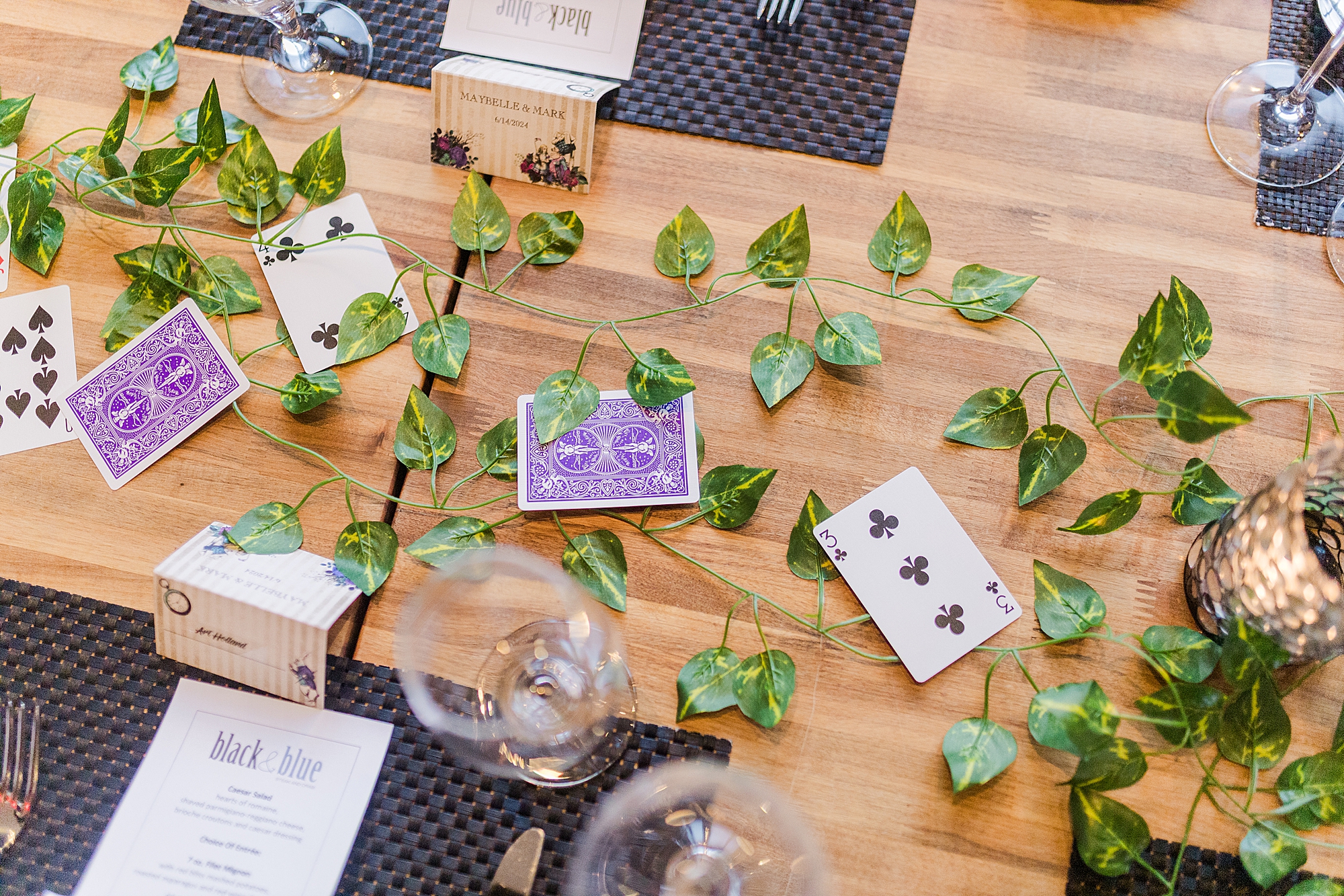 wedding decorations laying on top of dining room table 