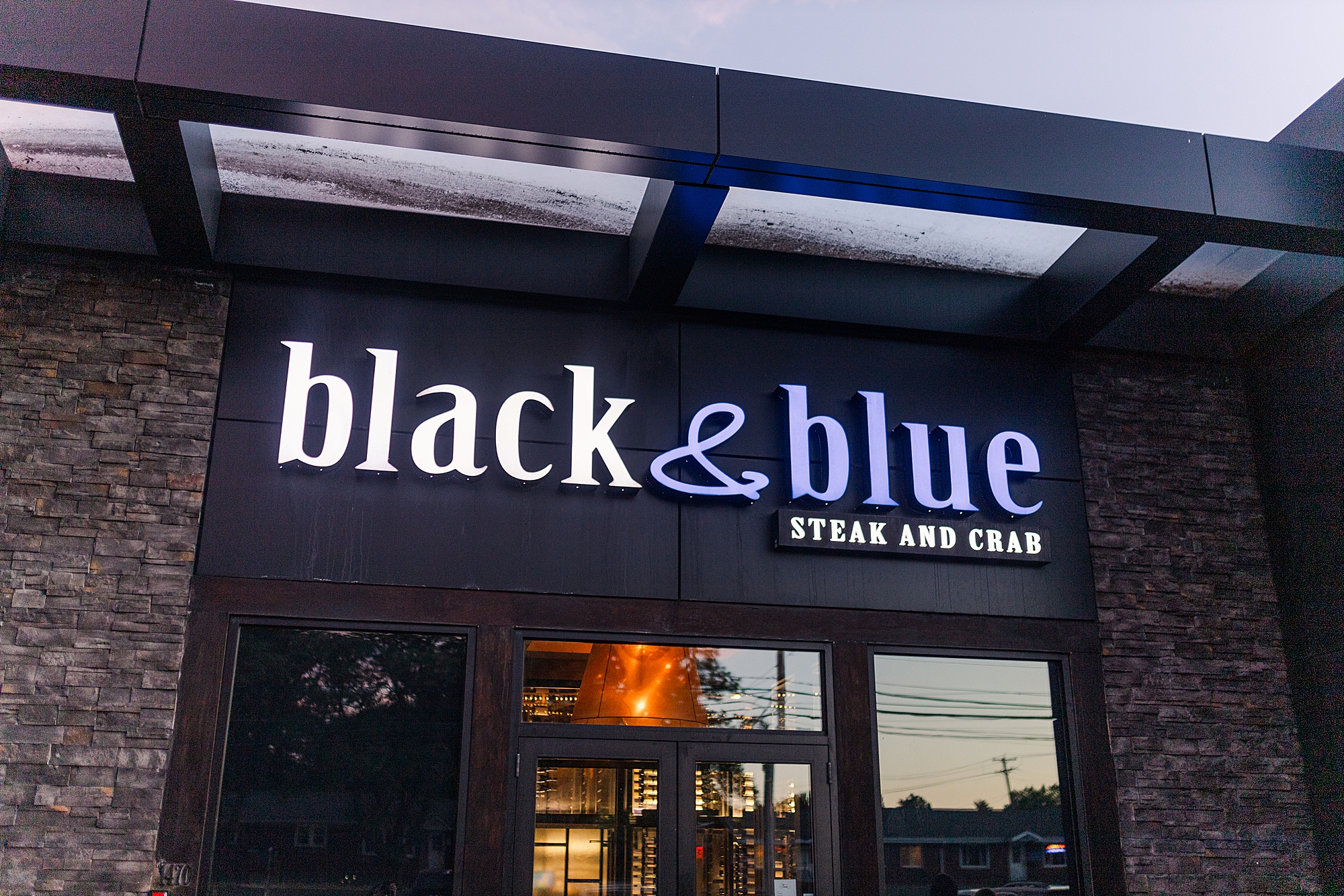 close up of restaurant neon sign at sunset 