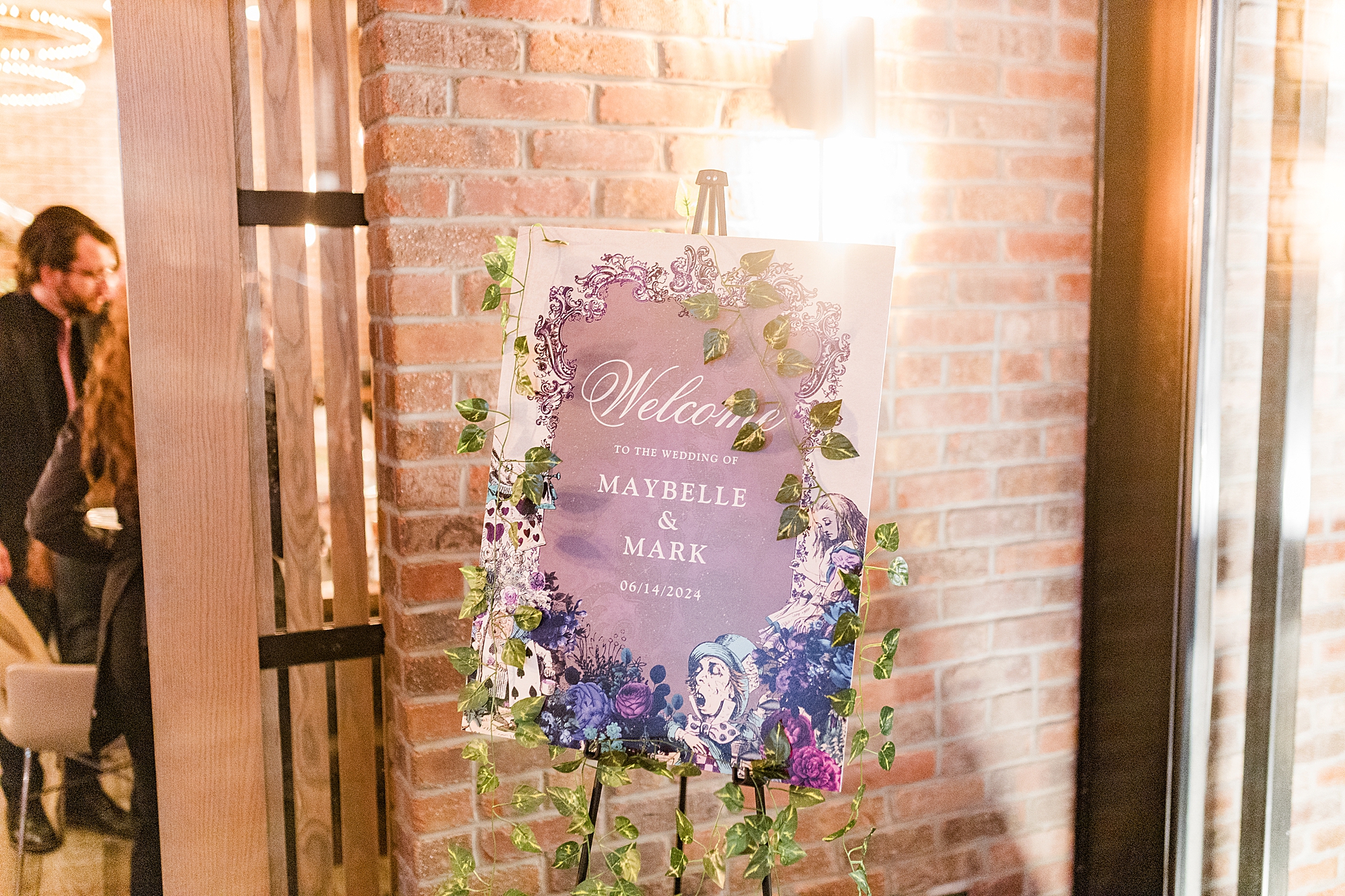 welcome sign at wedding reception inside restaurant 