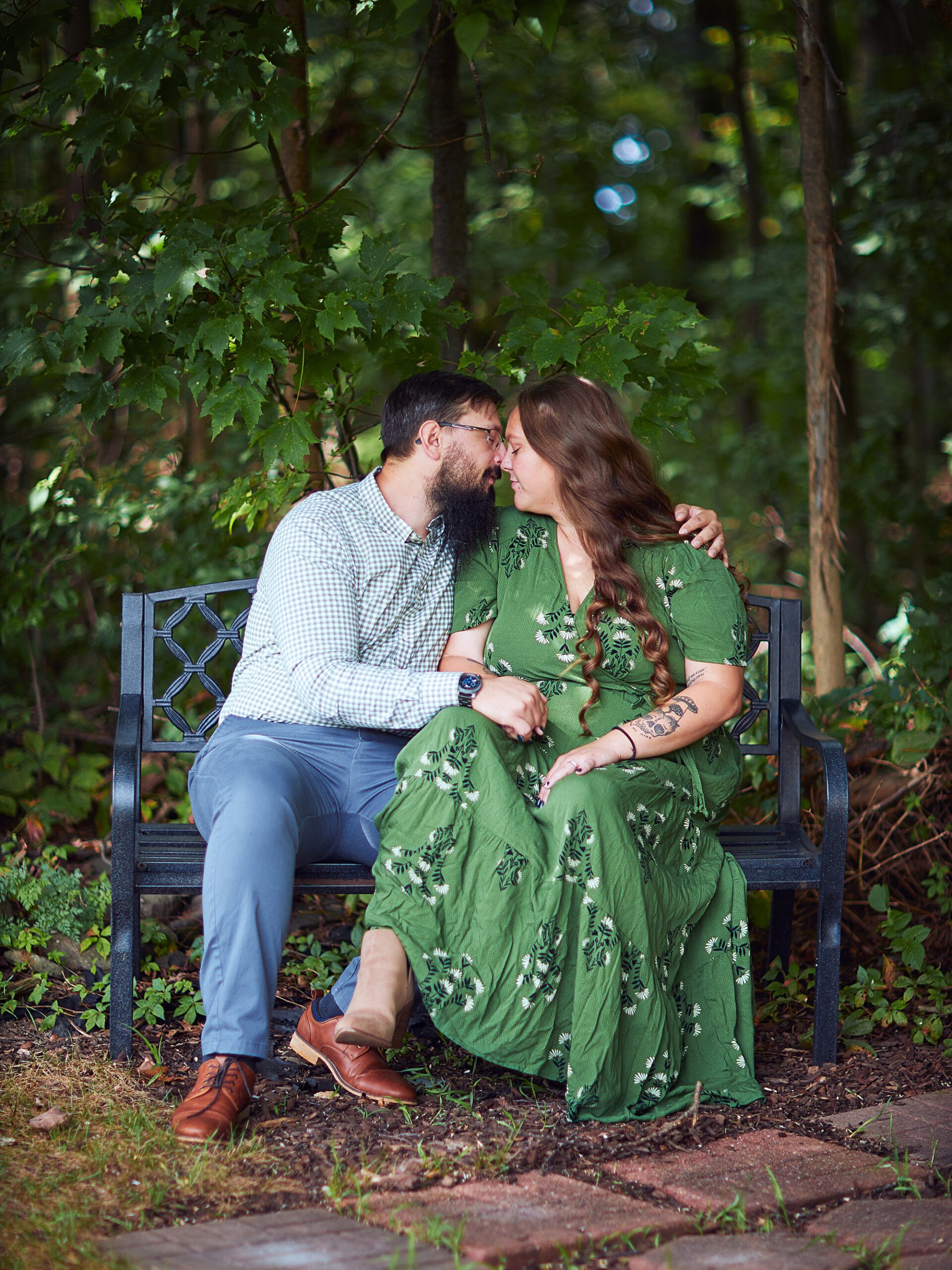 couple embracing sitting on a bench