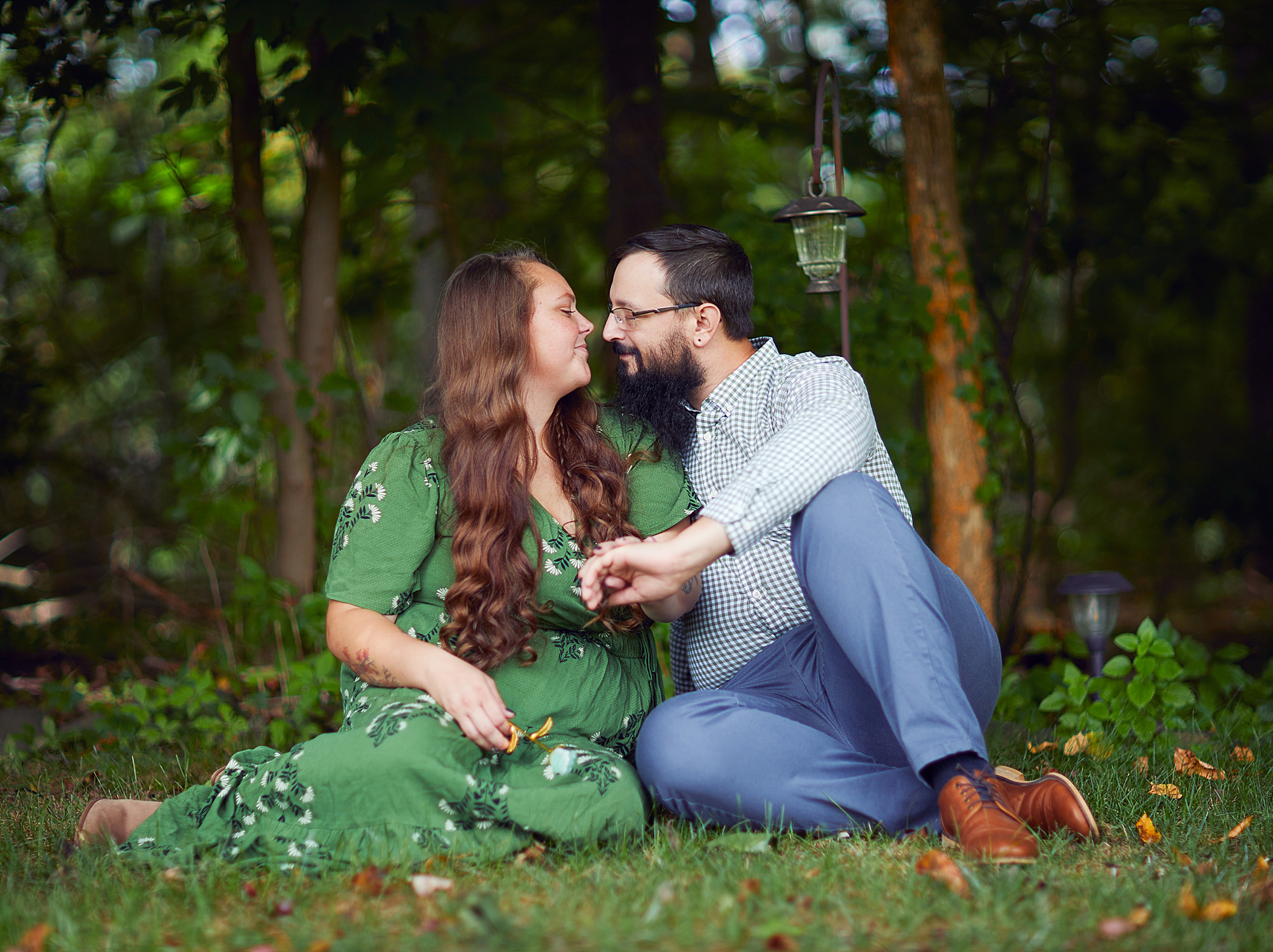 couple sitting together on the grass