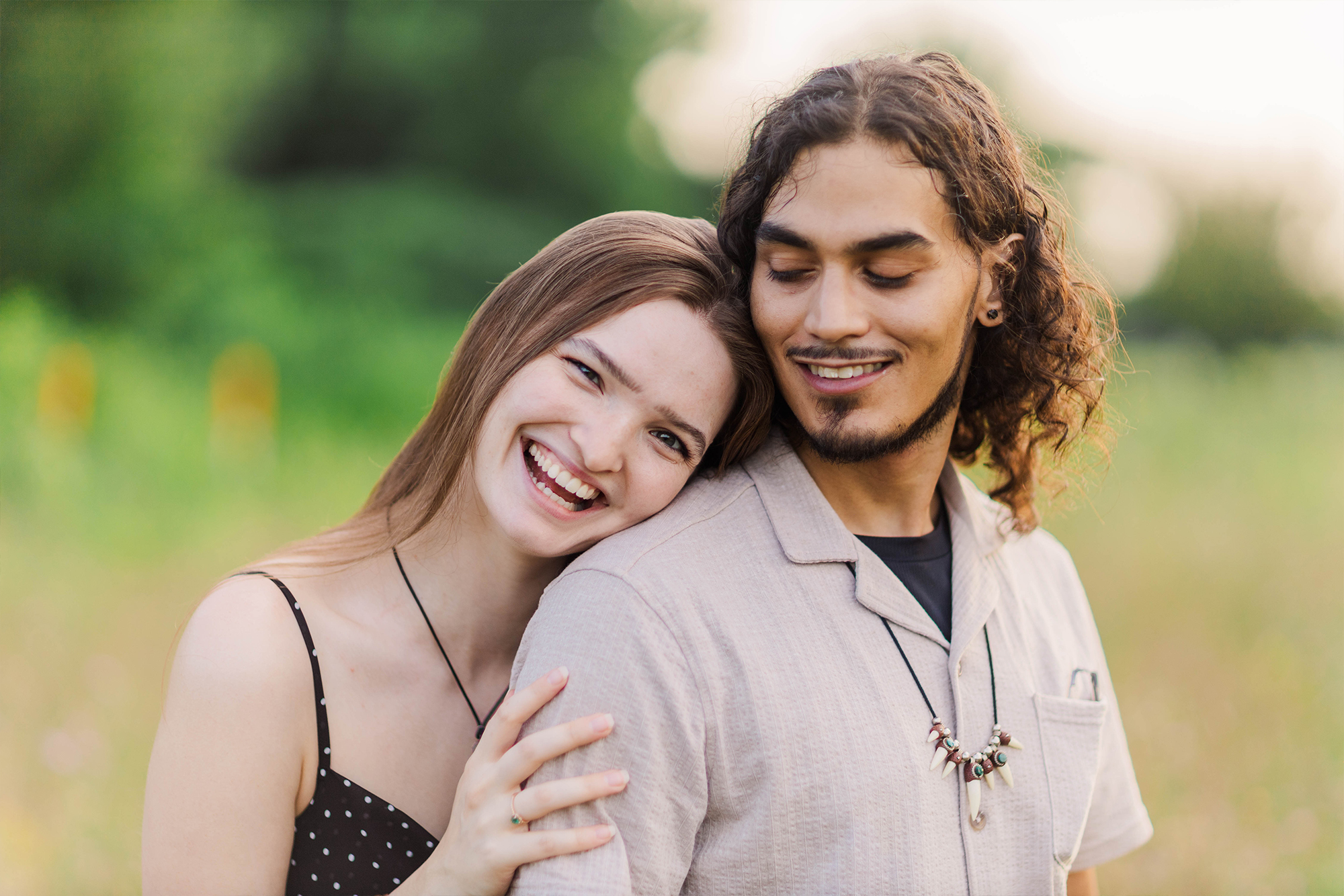 girlfriend leaning on boyfriend while laughing