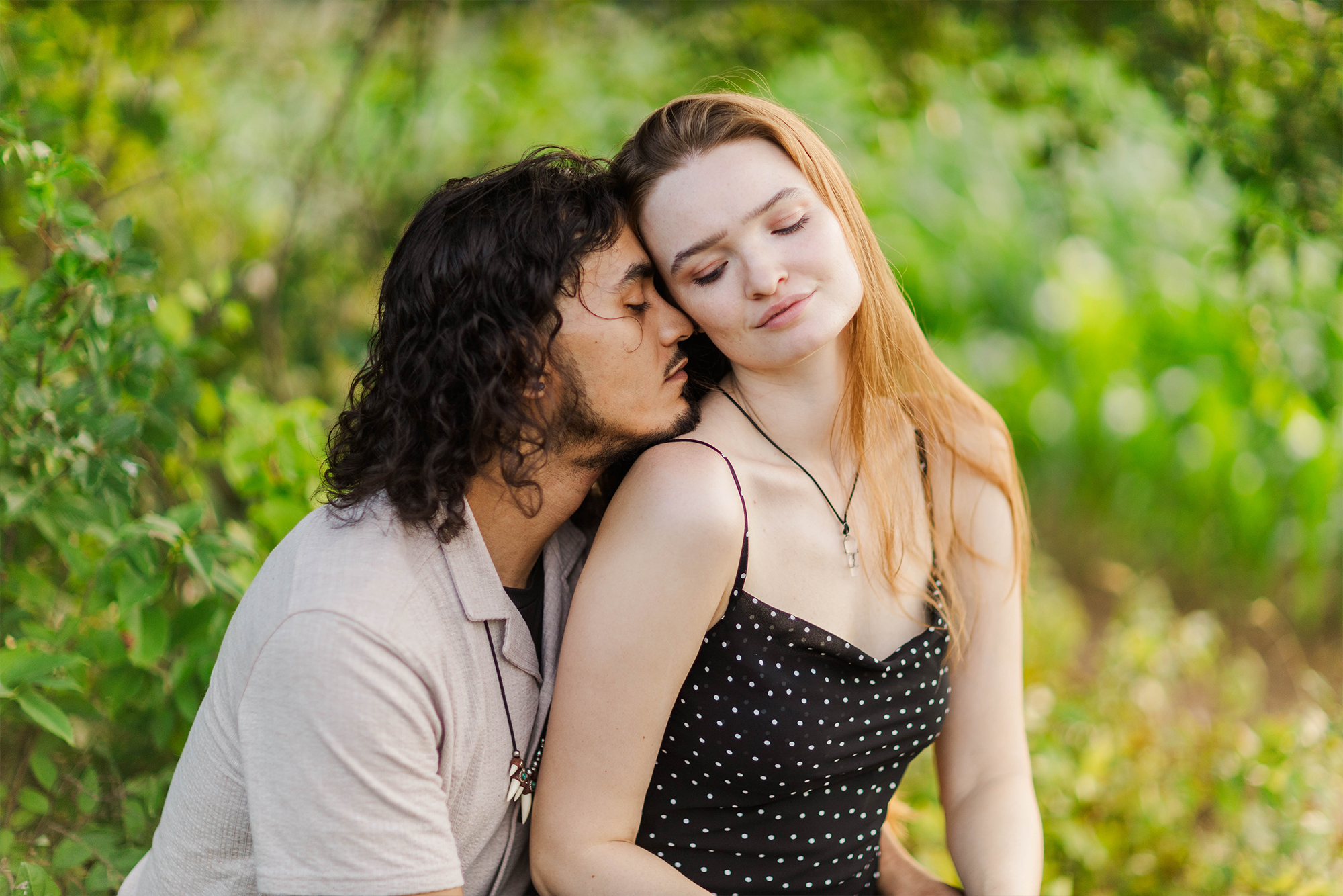 boyfriend and girlfriend sitting in nature together