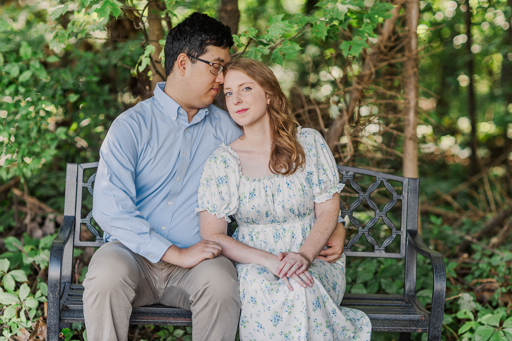 couple sitting with each other on bench