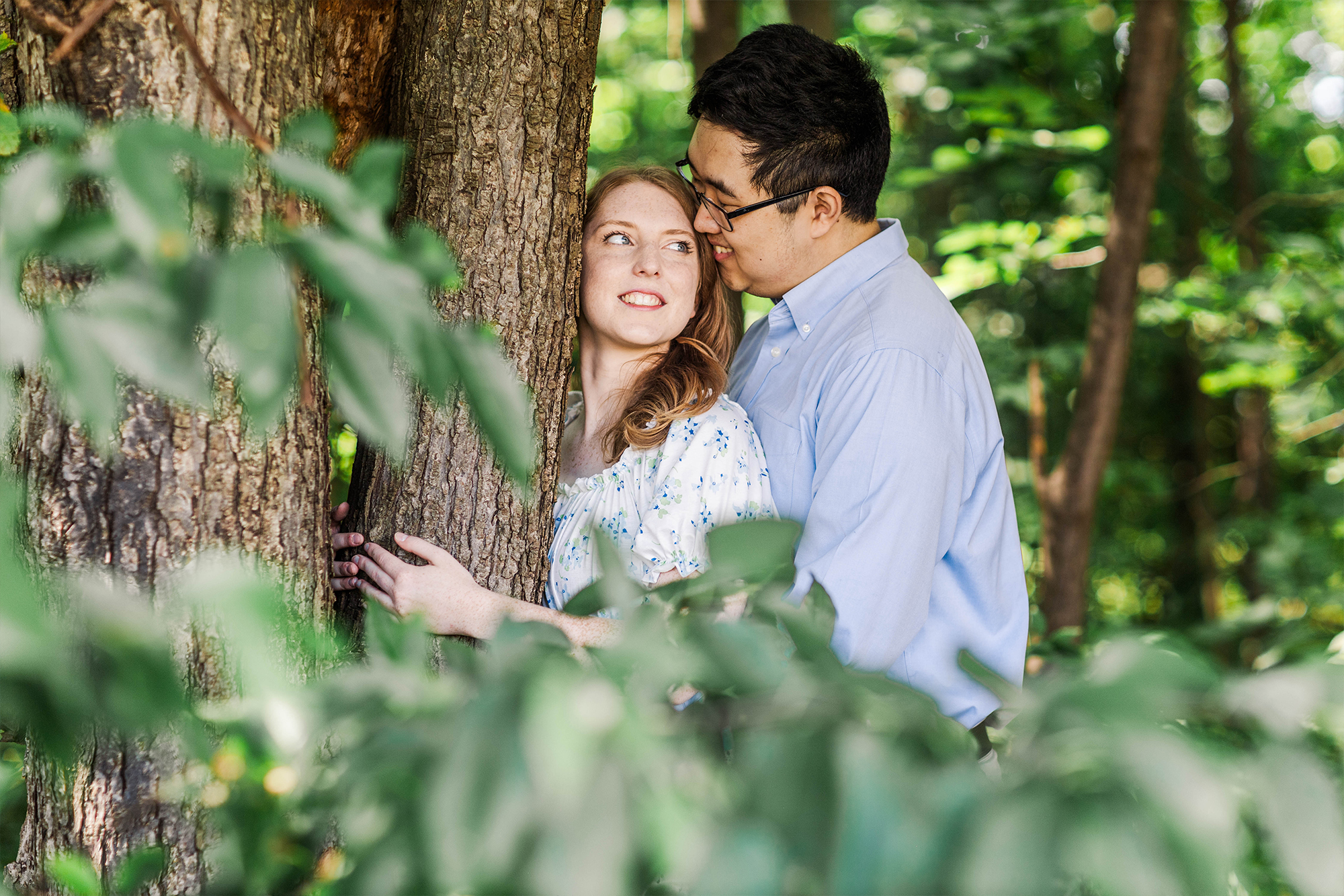 boyfriend holding girlfriend in tall grass