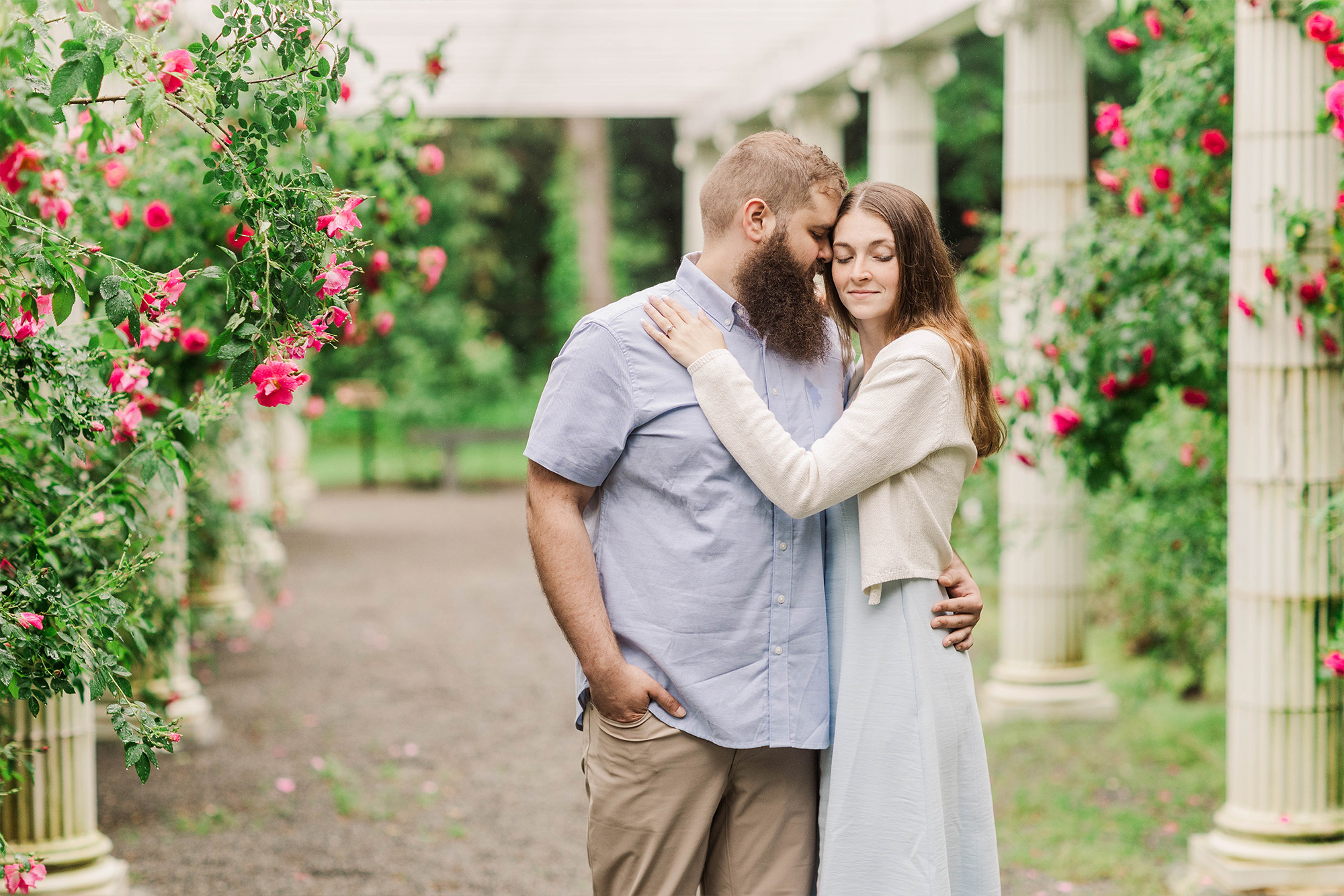 couple in romantic gardens with flowers