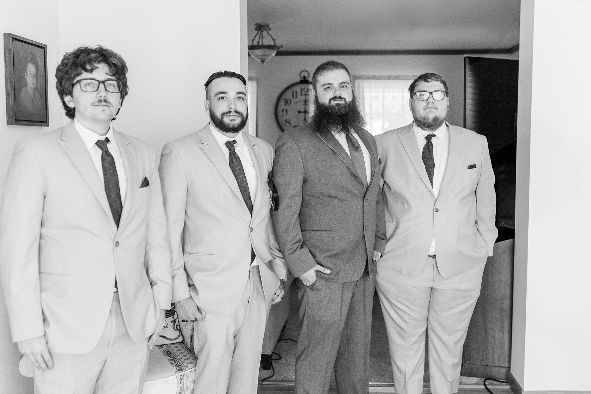 groom and groomsmen portrait in living room