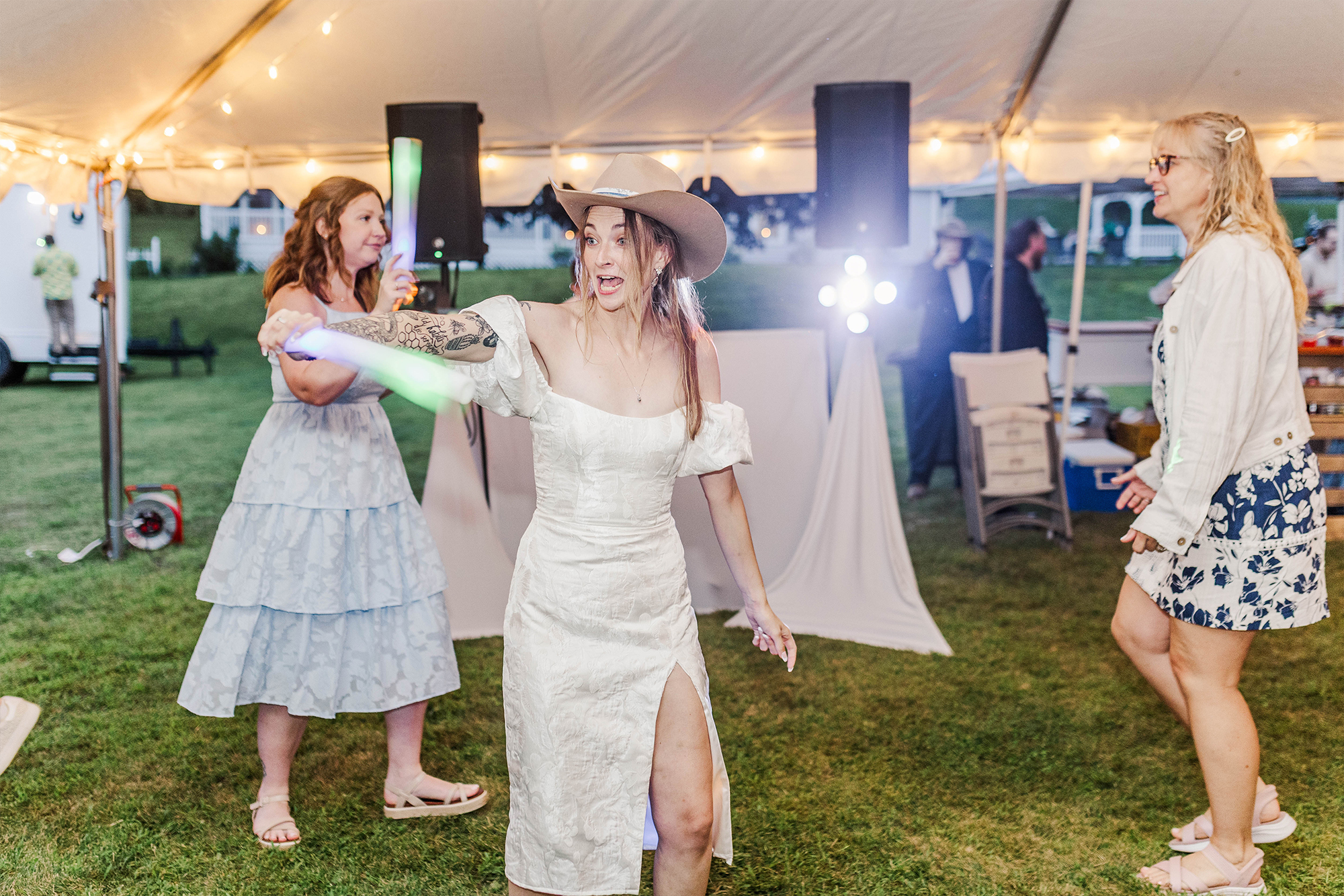 bride dancing with guests during evening