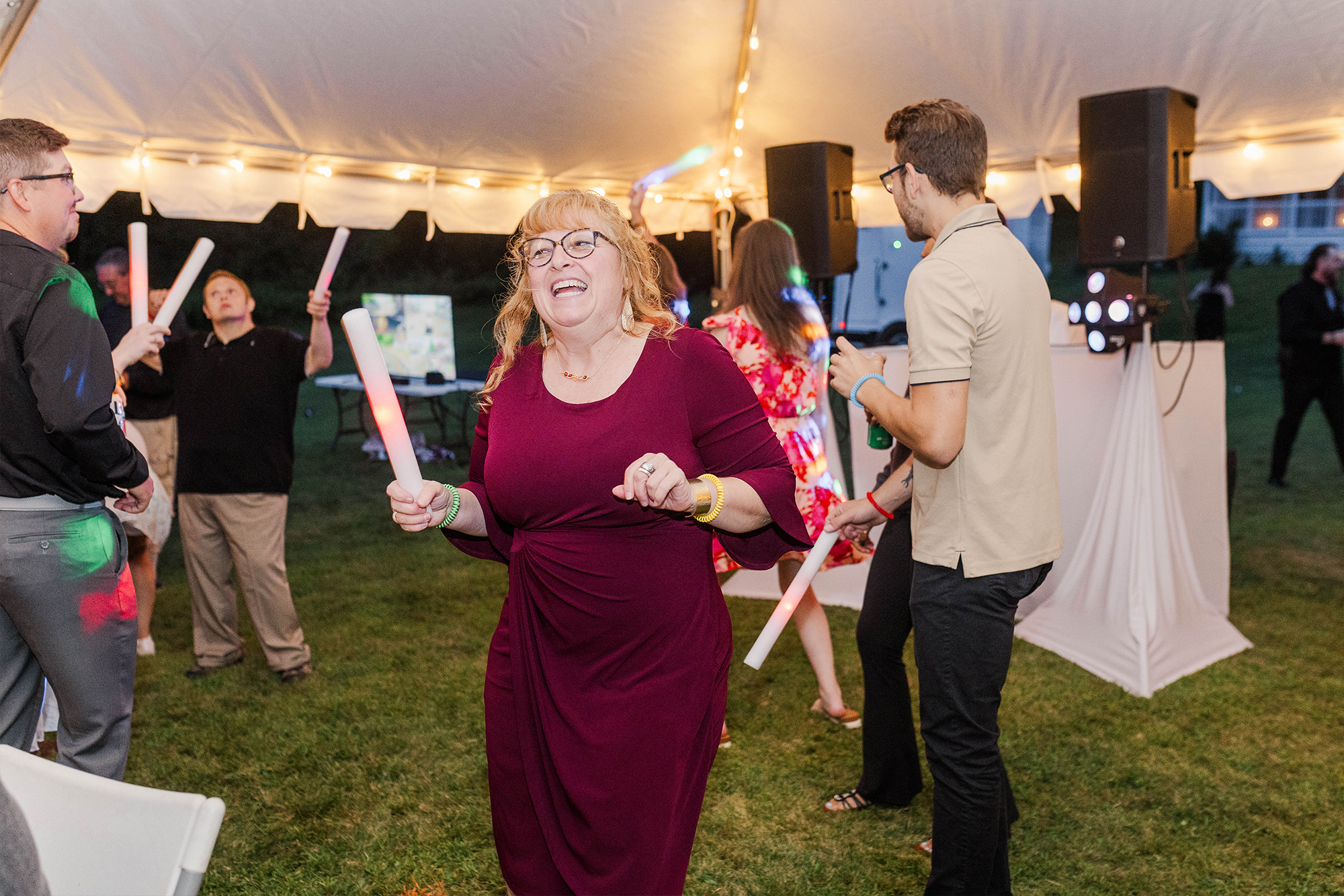 wedding guests dancing with light sticks
