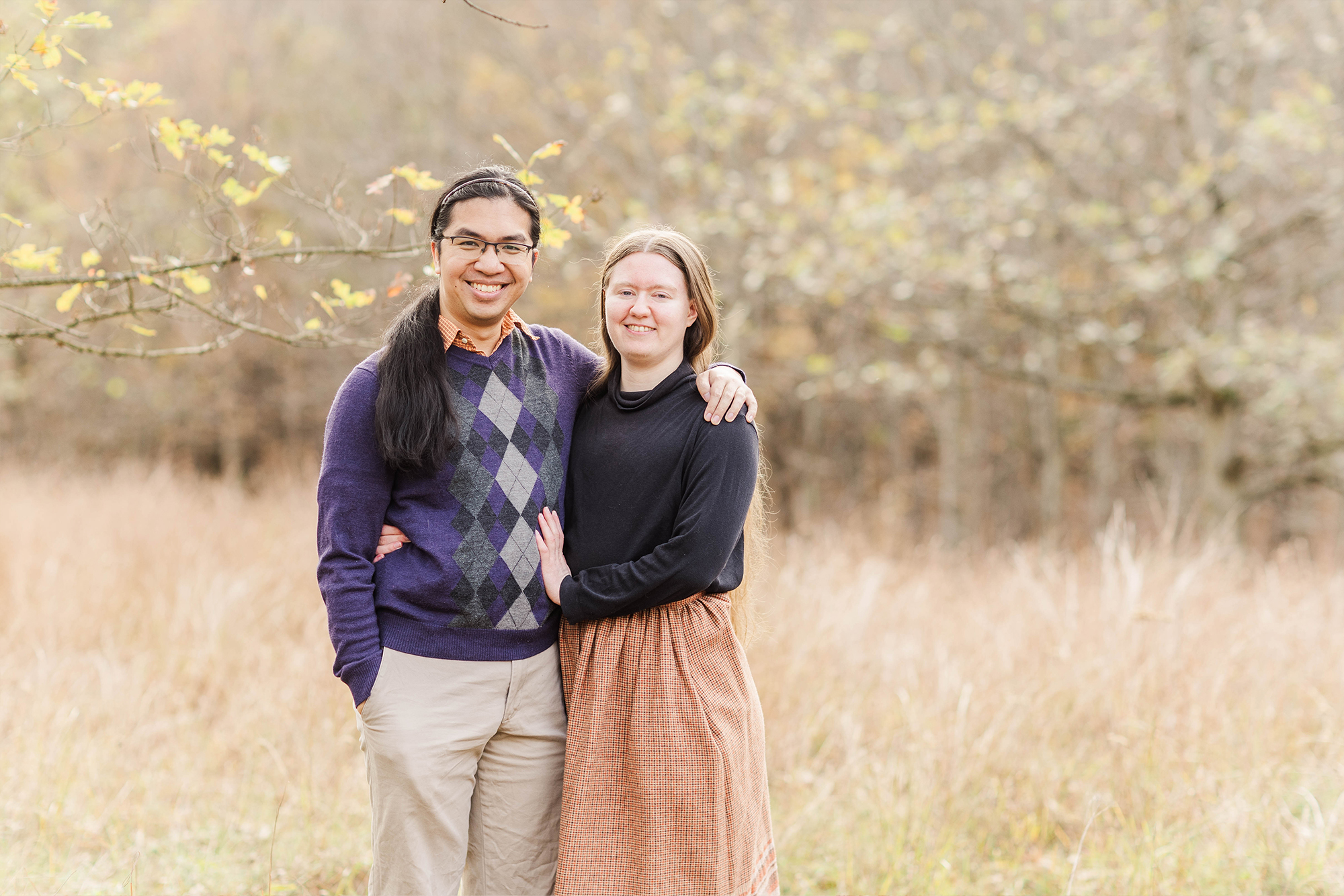 couple posing together in park 