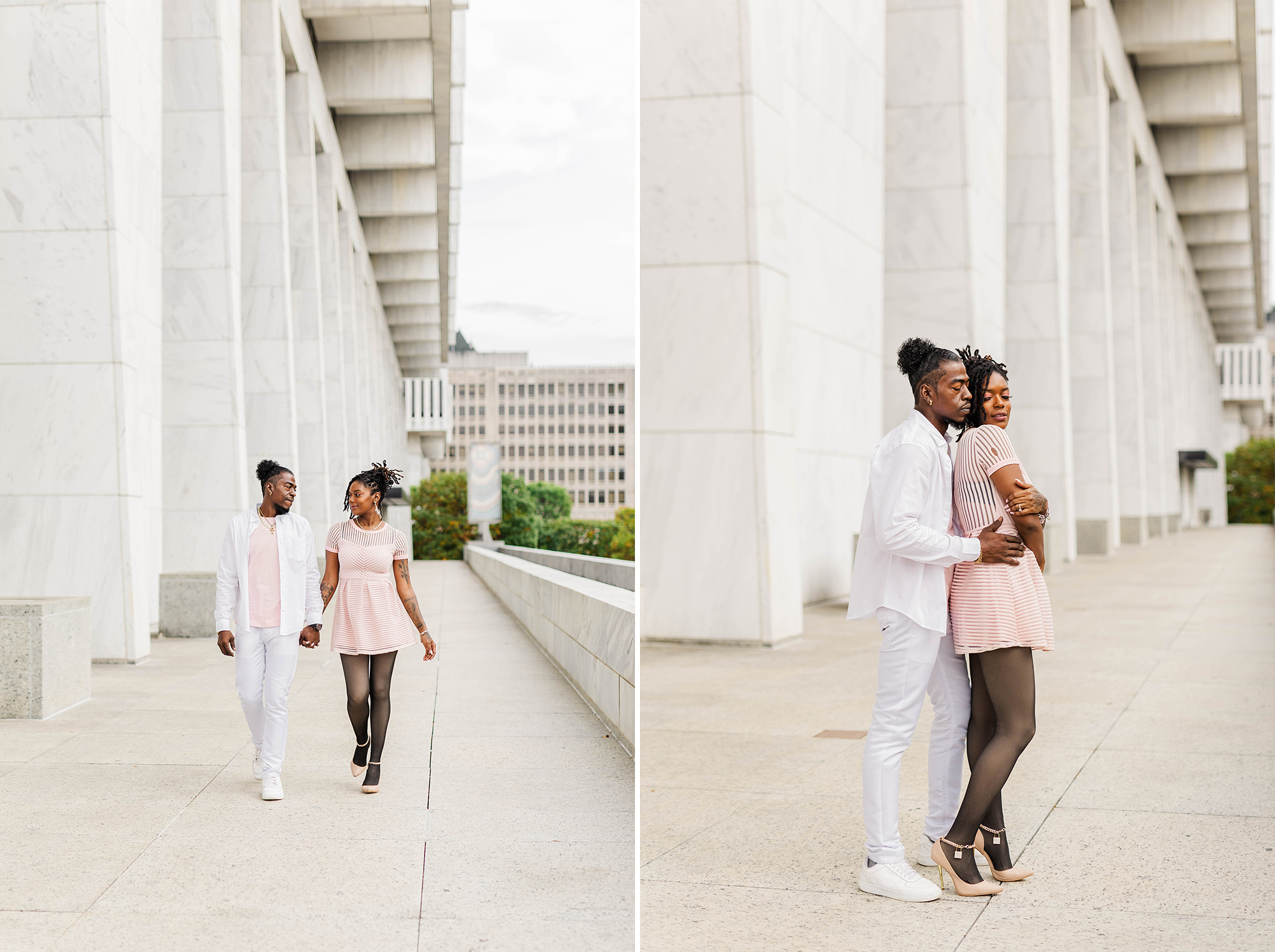 couple walking hand in hand and posing in front of large architectural office building