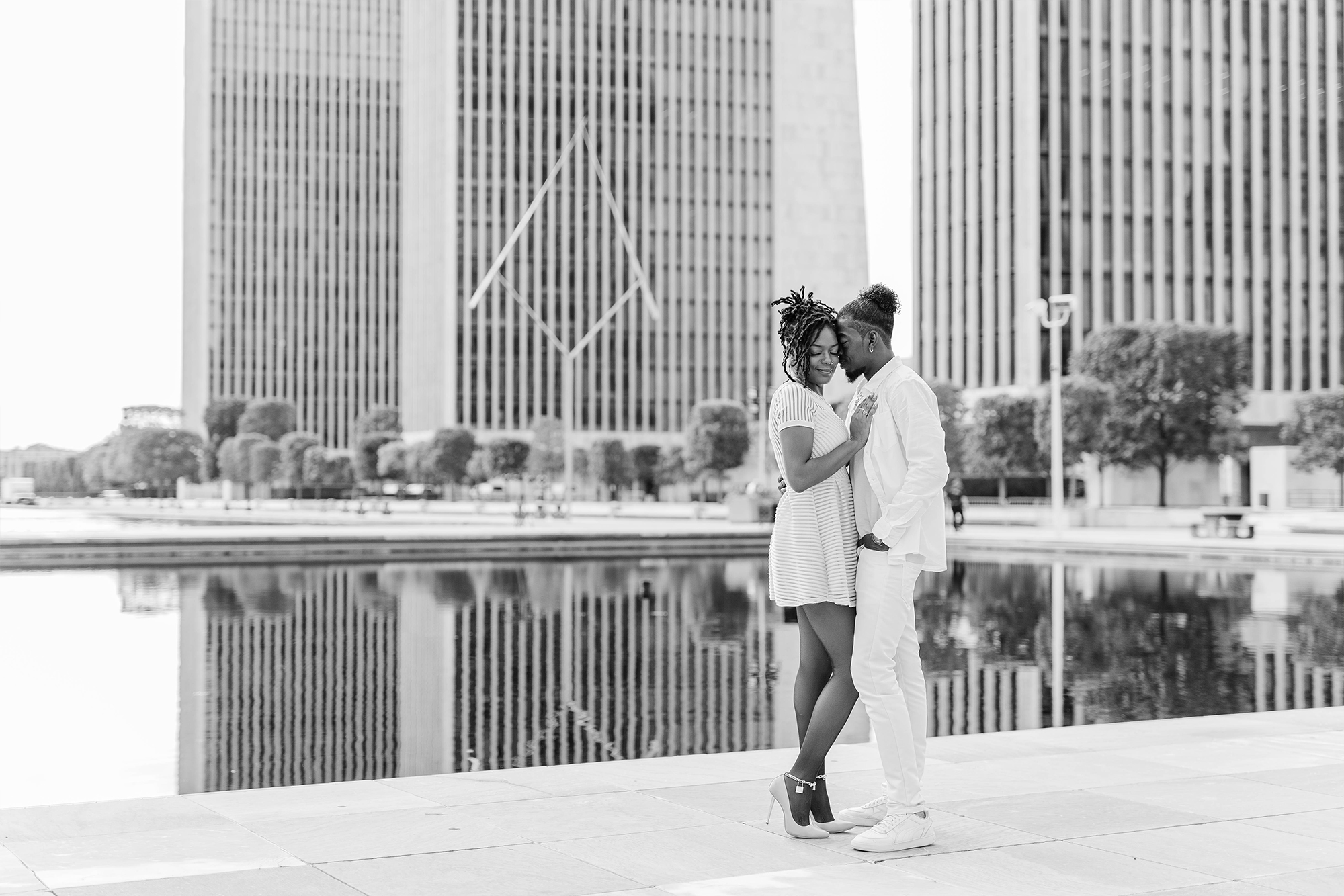 couple posing with each other surrounded by buildings