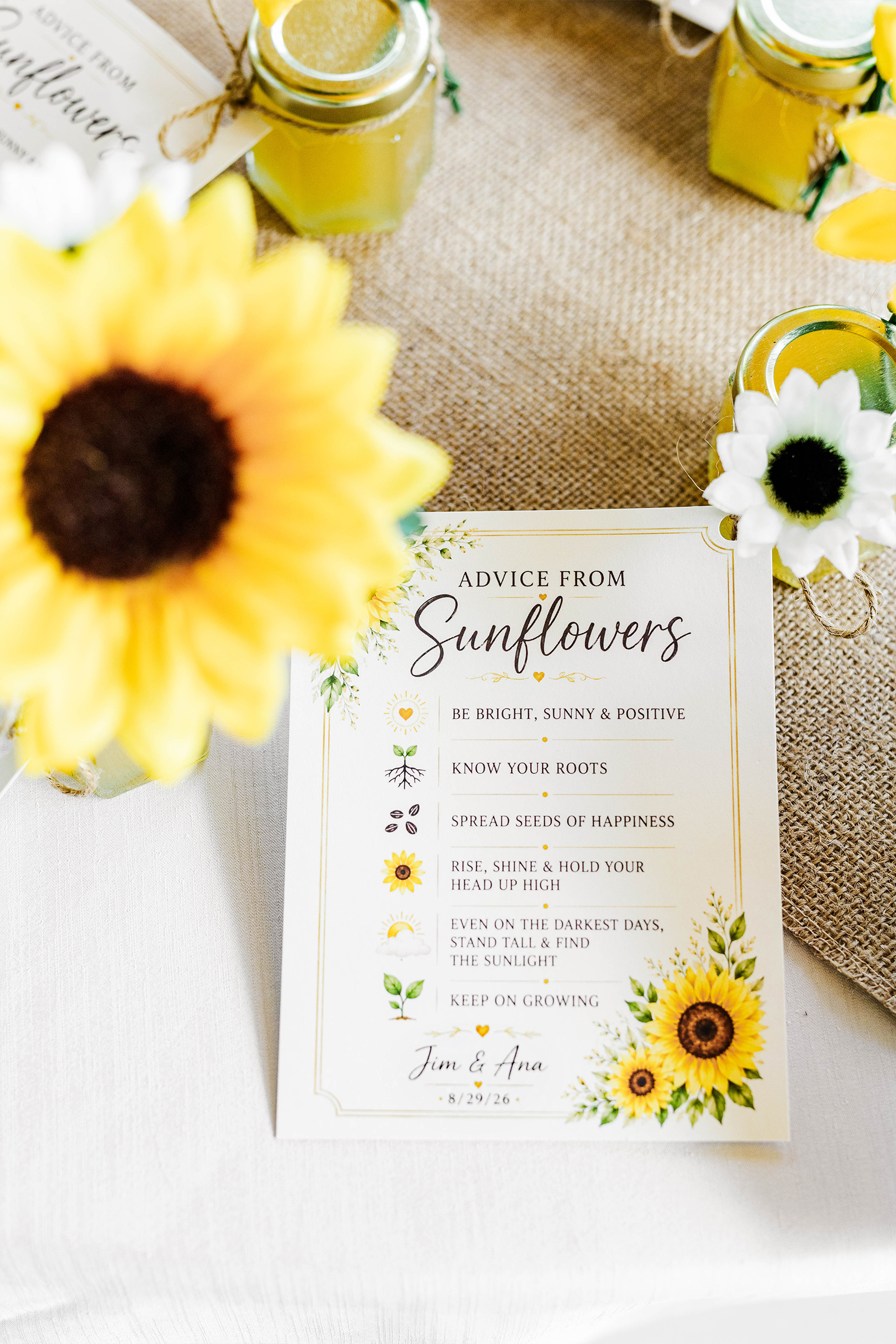 wedding invitation with sun flowers on reception dining table