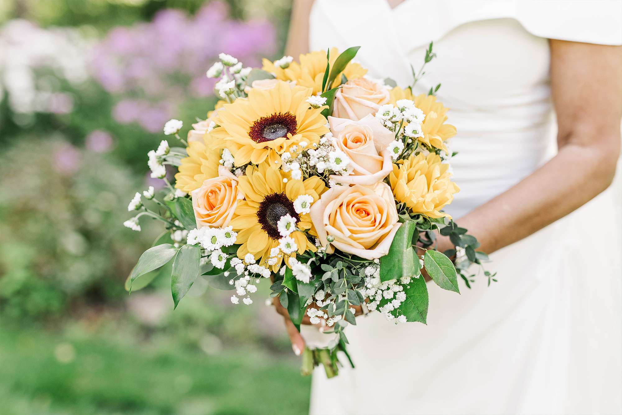 detail shot of bridal bouquet with flowers in background