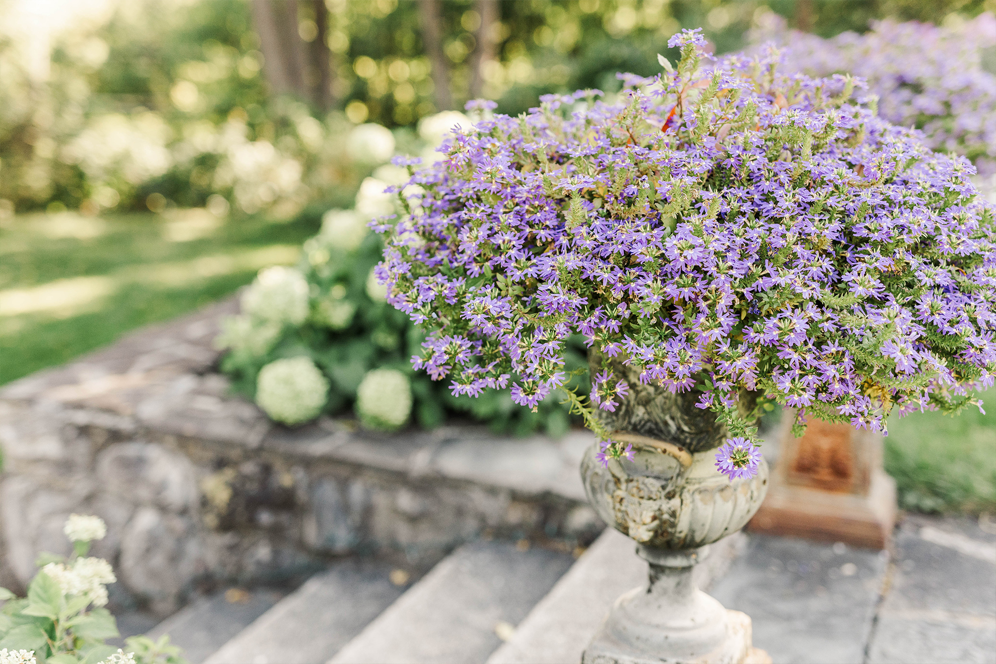 ceremony entrance with stone flower planters