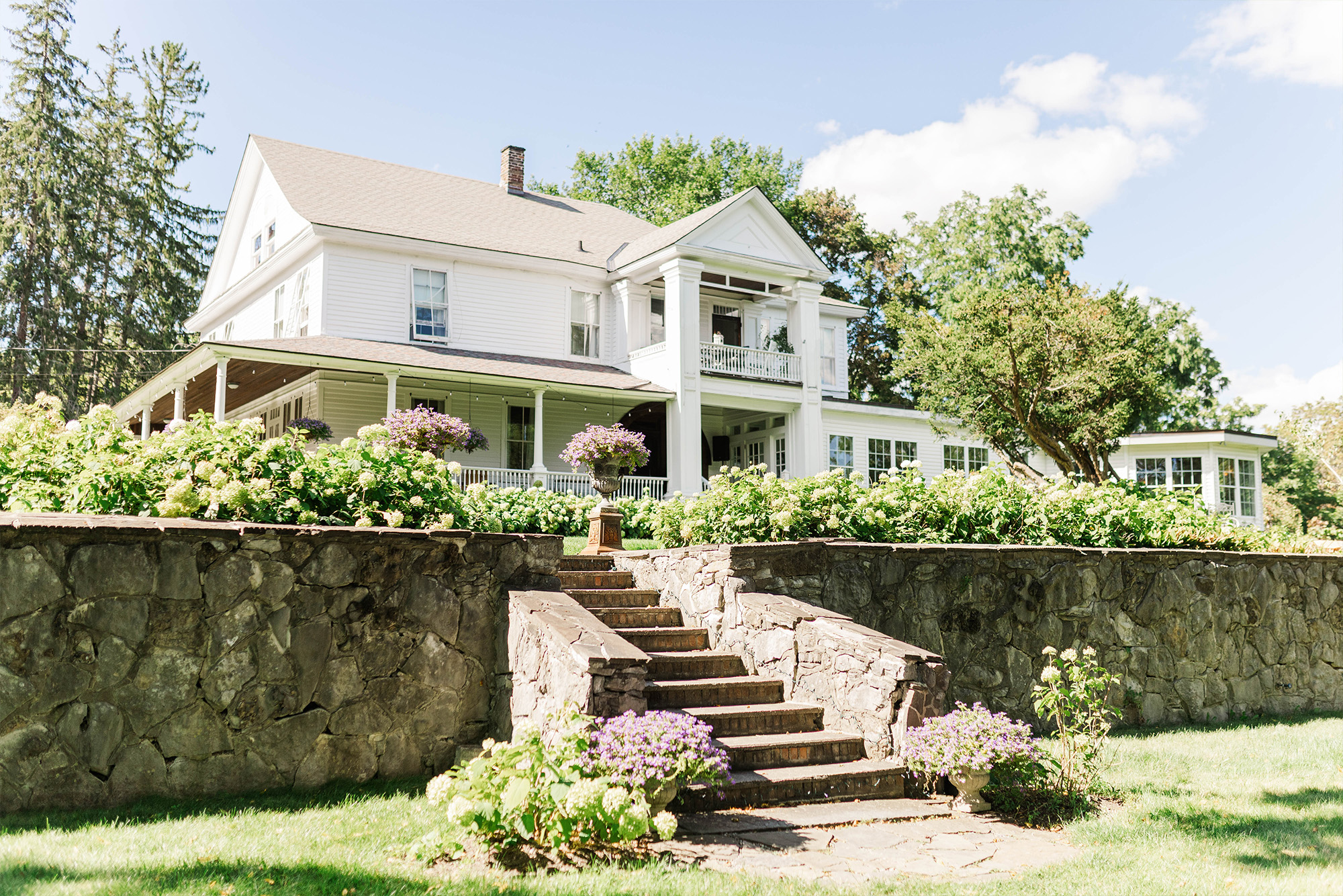 wedding venue manor with stone stairs and flowers