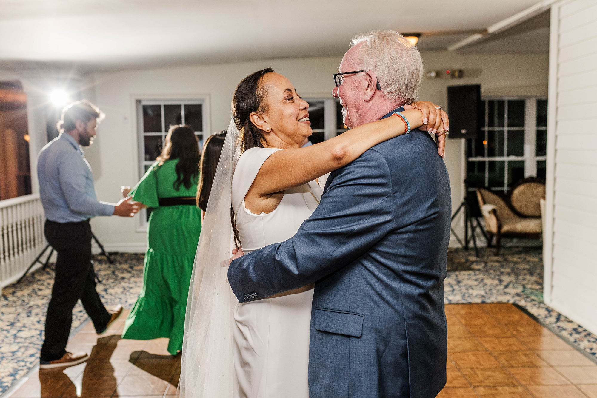 bride and groom dancing with each other in front of dj set up